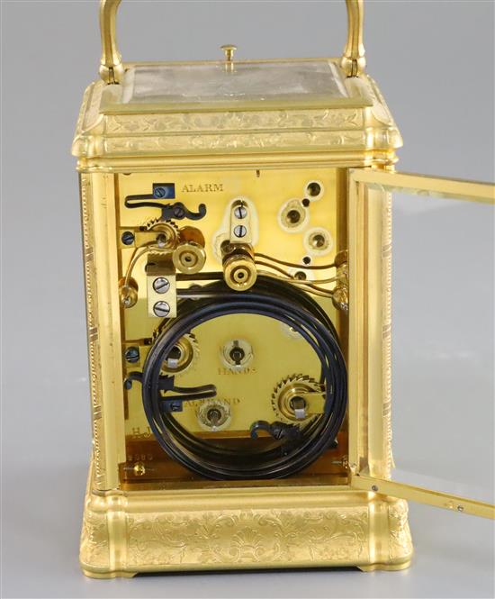 A late 19th century French ormolu quarter repeating carriage alarum clock, 5.75in., with leather travelling case